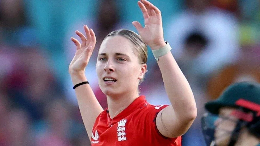 Freya Kemp holds her arms aloft