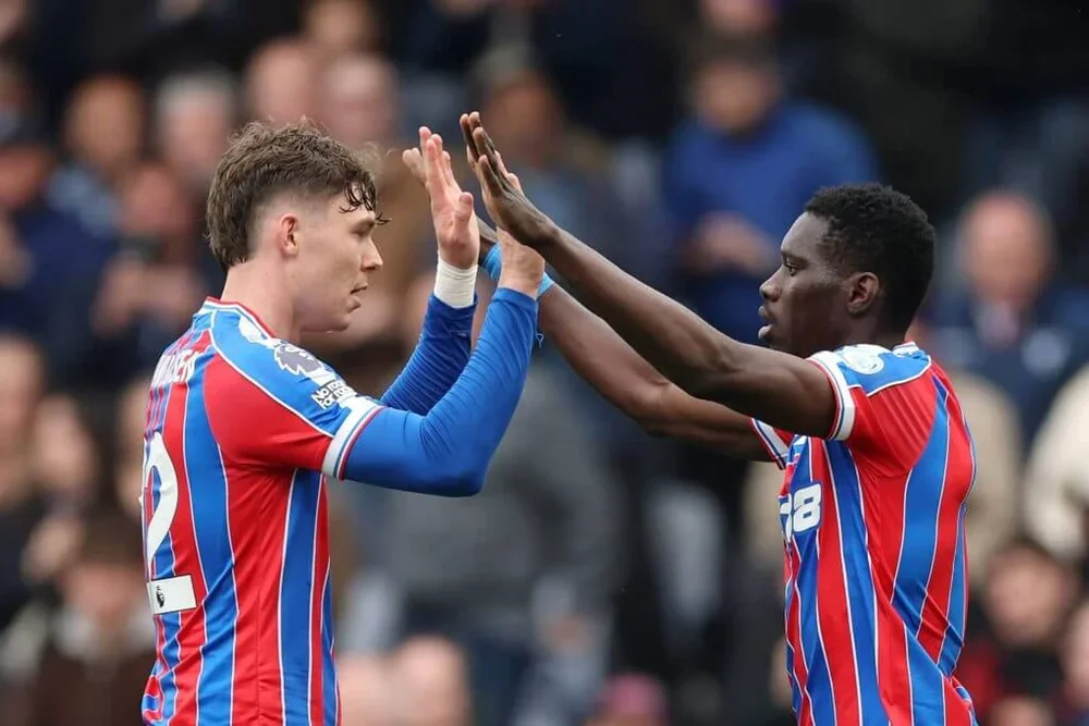 Jorgen Strand Larsen and Ismaila Sarr high five after the latter's first-half equaliser